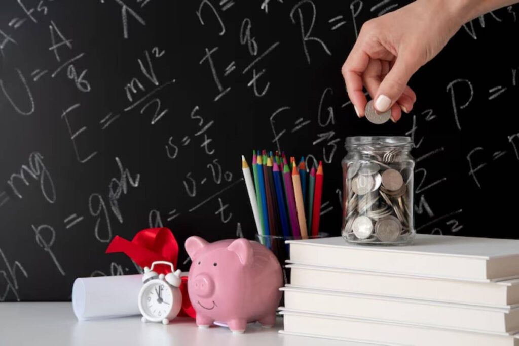 A hand drops a coin into a jar filled with coins on a desk with books, colored pencils, a piggy bank, and a clock, against a math backdrop.