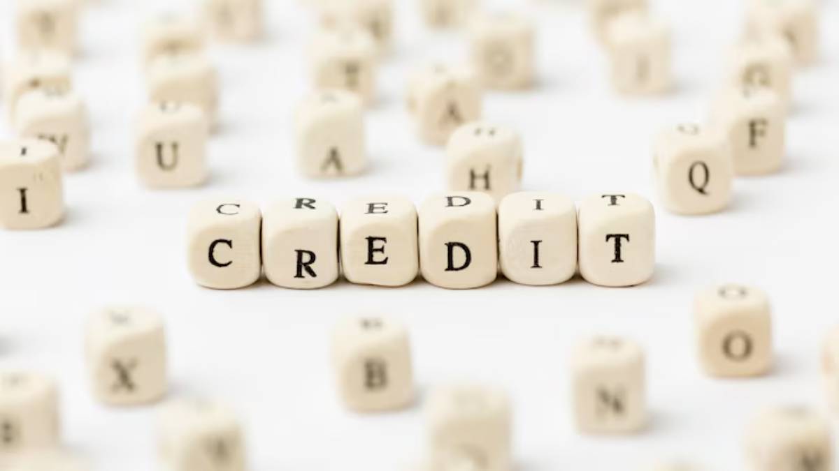 Close-up of scattered letter blocks with the word CREDIT clearly highlighted in the center, symbolizing finance and credit concepts.